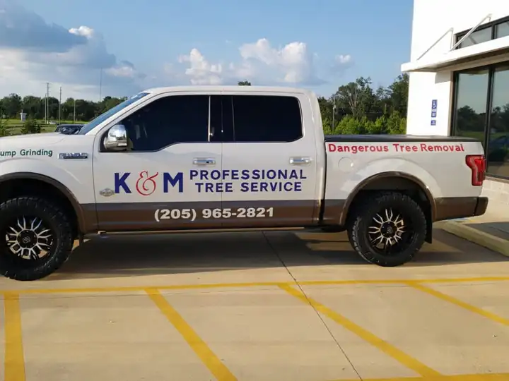 K&M pickup lettered for stump grinding and dangerous tree removal